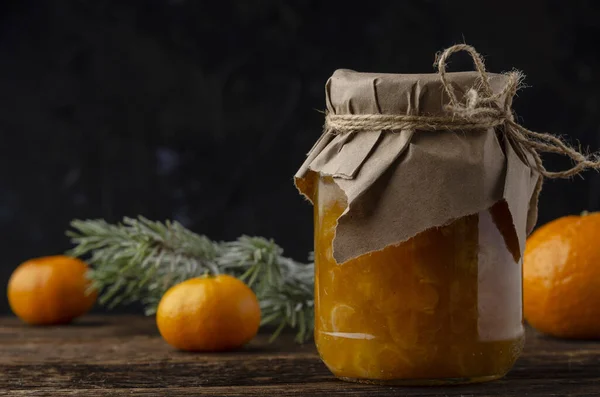 Tangarine marmalade jam in glass jar. Christmas winter mood. Homemade citrus cinnamon — Stock Photo, Image