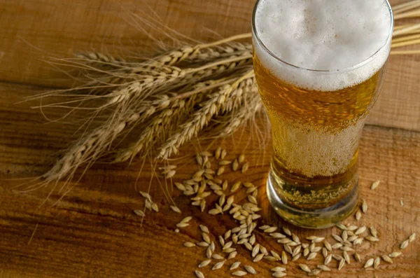 Bretzels and beer on wooden background. Oktoberfest food