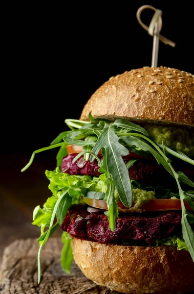 Veggie beet and lentil burgers with vegetables and avocado sauce