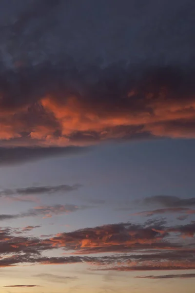 Autumn sunrise. Colorful clouds on the sky.