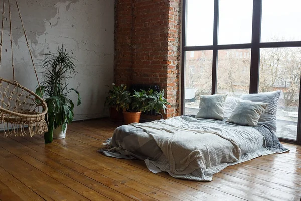 Cozy bedroom interior with wide bed, big windows. staying home during quarantine — Stock Photo, Image