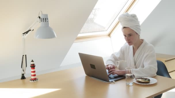 Freelance woman in white bathrobe, towel on head. stay home quarantine concept — Stock Video