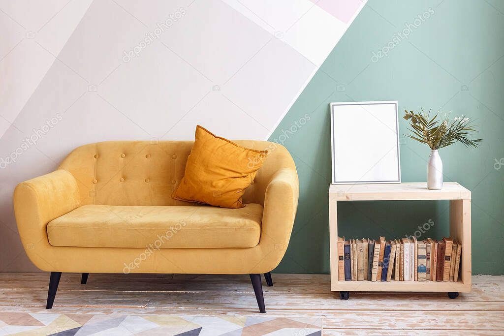 Nice living room with couch, carpet, green plant on a bookcase