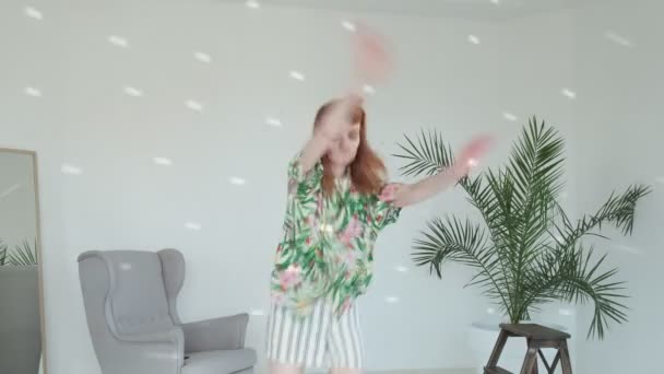 Playful carefree happy girl jumps, fools around, dances, goes crazy with music — Stock Video