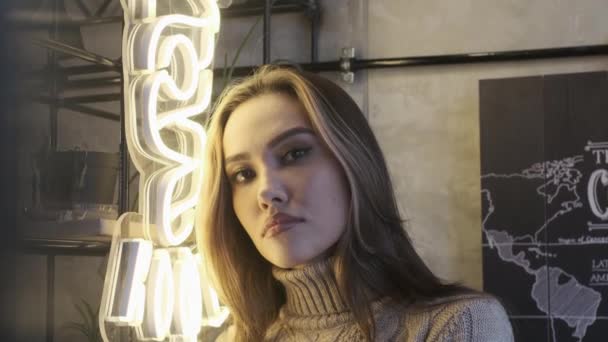 RUSSIA, VLADIMIR, 08 DEC 2019: young asian thoughtful pretty girl at cozy cafe — Stock Video