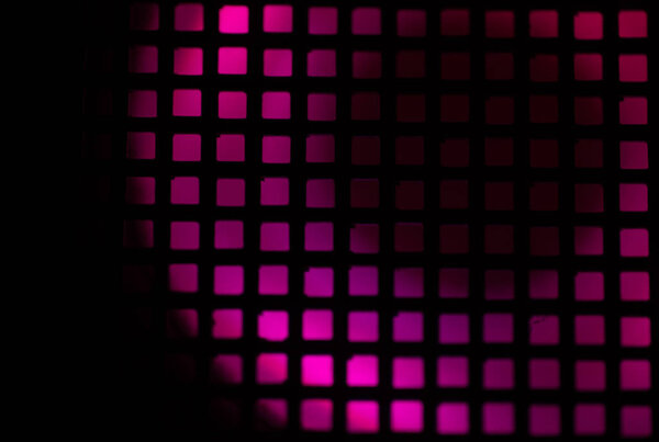 Abstract Macro close up of bright lights seen across a grid