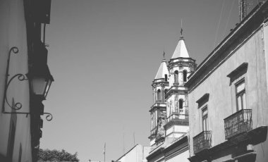 Black and white portrait of street in the historic district of Quertaro, Mexico clipart