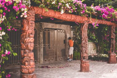 Puerto Morelos, Riviera Maya, Mexico This original coastal fishing village is now a quiet, colorful mixed-use neighborhood of private homes, few hotels, beautiful vegetation, bars, condominiums, restaurants, and nice caribbean turqoise beach clipart