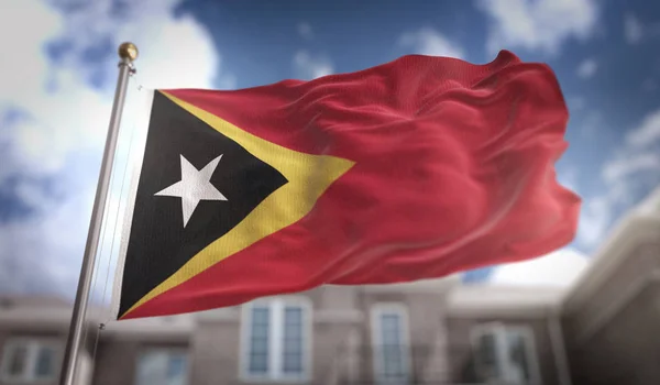 East Timor Flagge 3d Rendering auf blauem Himmel Gebäude Hintergrund — Stockfoto