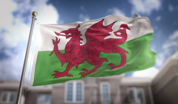 Wales Flag 3D Rendering on Blue Sky Building Background — Stock Photo, Image