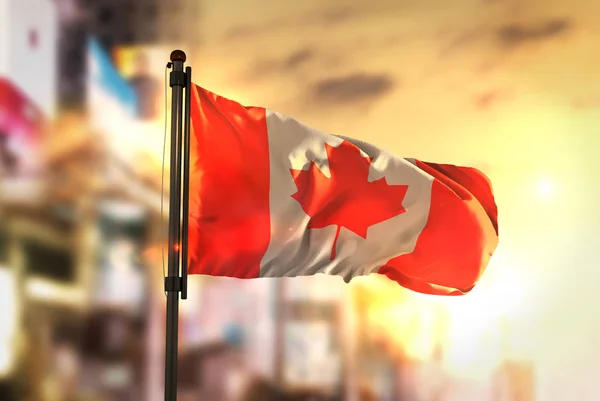 Canada Flag Against City Blurred Background At Sunrise Backlight — Stock Photo, Image
