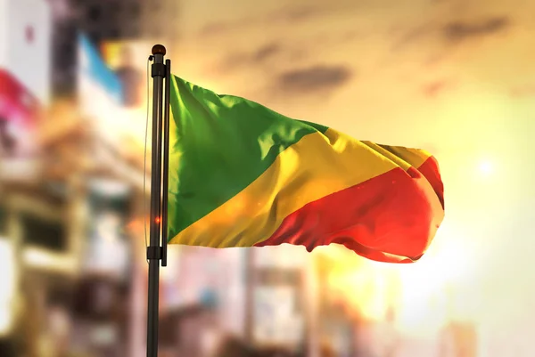 Republic of the Congo Flag Against City Blurred Background At Su — Stock Photo, Image