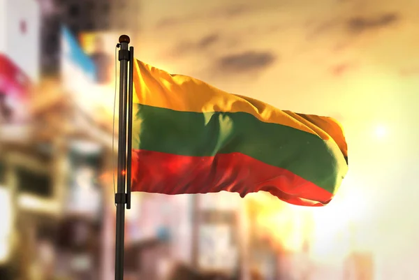 Lithuania Flag Against City Blurred Background At Sunrise Backli — Stock Photo, Image