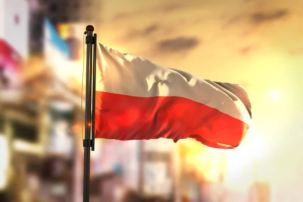 Poland Flag Against City Blurred Background At Sunrise Backlight — Stock Photo, Image