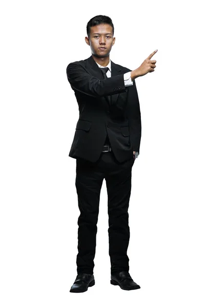 Full Body Young Asian Businessman Pointing Something Isolated Wh — Stok Foto