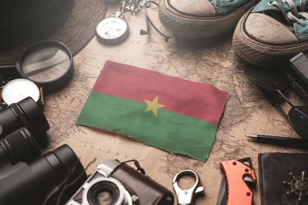 Burkina Faso Flag Between Traveler's Accessories on Old Vintage — Stock Photo, Image