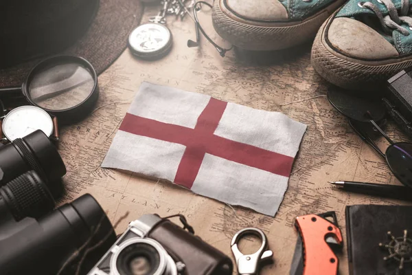 England Flag Between Traveler 's Accessories on Old Vintage Map. — Stock fotografie