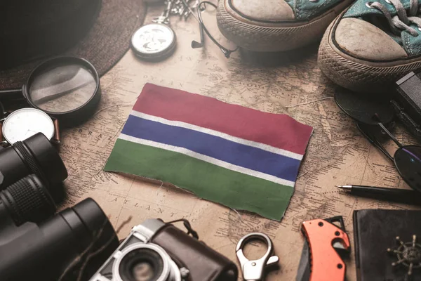 The Gambia Flag Between Traveler's Accessories on Old Vintage Ma — Stock Photo, Image