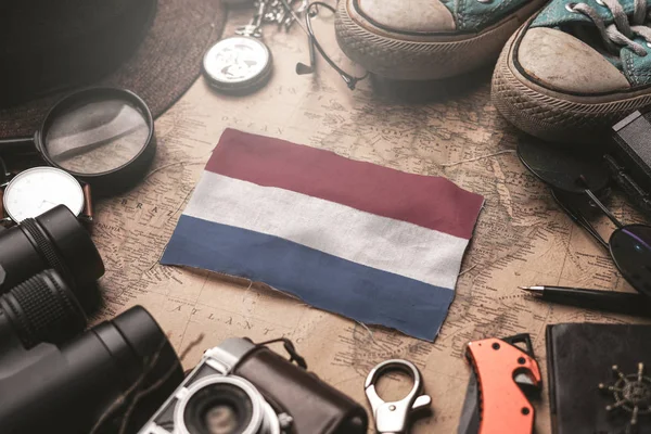 Netherlands Flag Between Traveler's Accessories on Old Vintage M — Stock Photo, Image