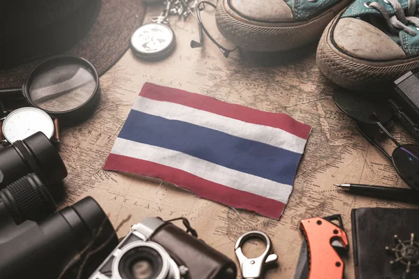 Thailand Flag Between Traveler's Accessories on Old Vintage Map. — Stock Photo, Image