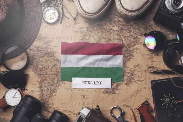 Hungary Flag Between Traveler's Accessories on Old Vintage Map. — Stock Photo, Image