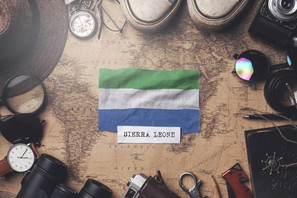 Sierra Leone Flag Between Traveler's Accessories on Old Vintage — Stock Photo, Image
