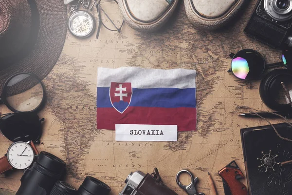 Slovakia Flag Between Traveler's Accessories on Old Vintage Map. — Stock Photo, Image