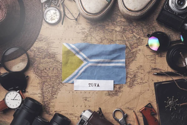 Tuva Flag Between Traveler's Accessories on Old Vintage Map. Ove — 스톡 사진