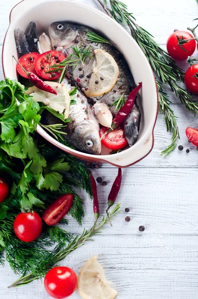 Raw fish cooking and ingredients.