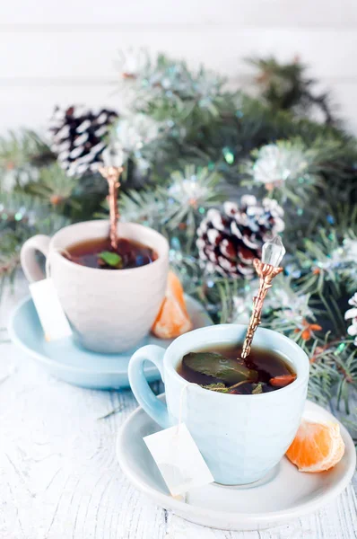 Two tea cups with teabag and xmas tree — Stock Photo, Image