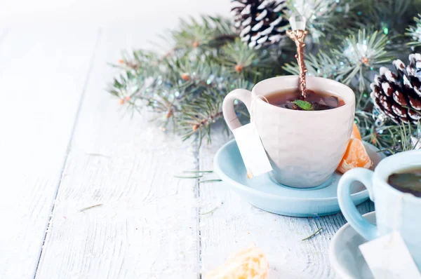 Two tea cups with teabag and xmas tree — Stock Photo, Image