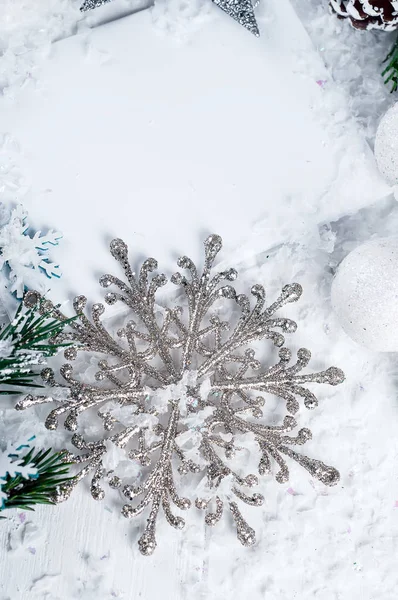 Silver snowflake on a white background — Stock Photo, Image