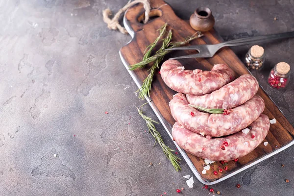 Raw sausages with spice — Stock Photo, Image