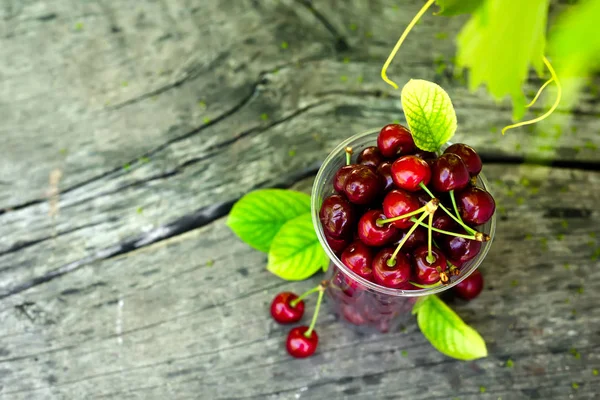 Cherries on wooden table — Stock Photo, Image