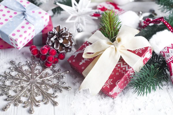 Christmas fir tree, decor, gift box and mittens Stock Image