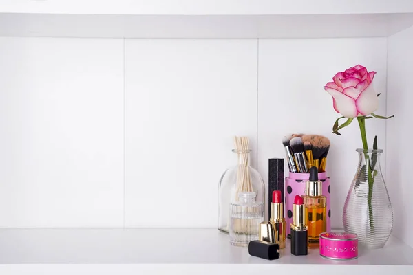 Shelf with cosmetics in bathroom on a white bathroom shelf — Stock Photo, Image