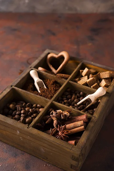 Spices, coffee and cookies in wooden box — Stock Photo, Image
