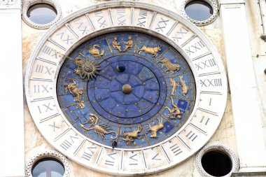 Astrological clock at the Torre dellOrologio in Venice. Astronomic clock at a tower at St. Marks square. Clocktower an early Renaissance building of the Piazza San Marco. Zodiac Dial. clipart