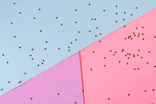 Golden stars on pink blue background. Holiday background. Minimal concept. Flat lay. Top view. — 스톡 사진