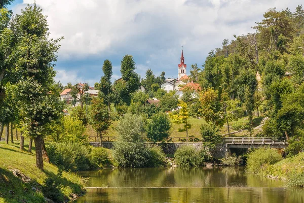 General village view with bridge and river — Stock Photo, Image