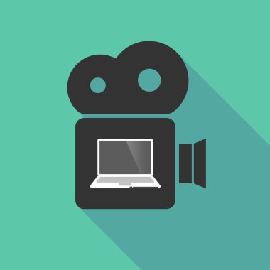 Uzun gölge sinema kamera ile bir laptop