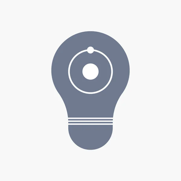 Icona della lampadina isolata con un atomo — Vettoriale Stock