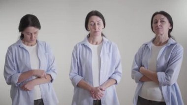Esmer, beyaz bir kadın. İki farklı kişiliği var. Başı kalkık, utangaç ve utangaç bir kadının üç katı görüntüsü. Yaşam tarzı, sosyal roller ve maskeler.