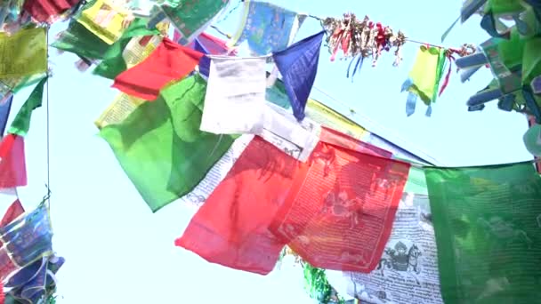 Teetering Colorful Ritual Flags Wind — Stock Video