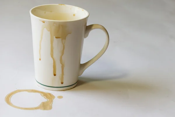 Dirty coffee cup on whire table — Stock Photo, Image