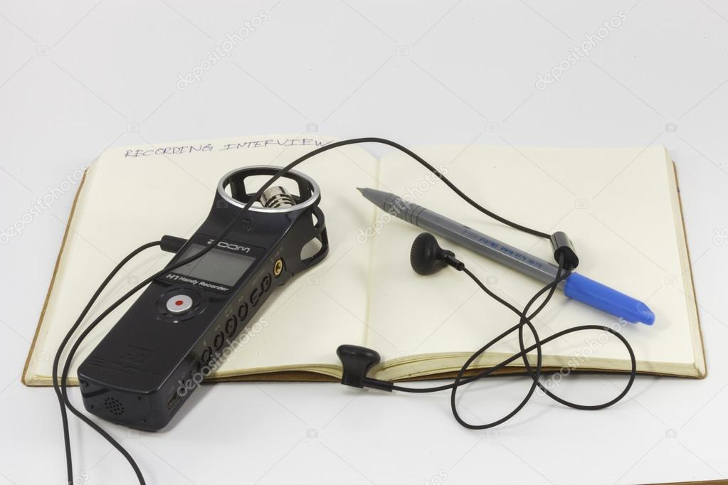 Recorder  equipment such as voice recorder, book and pen.