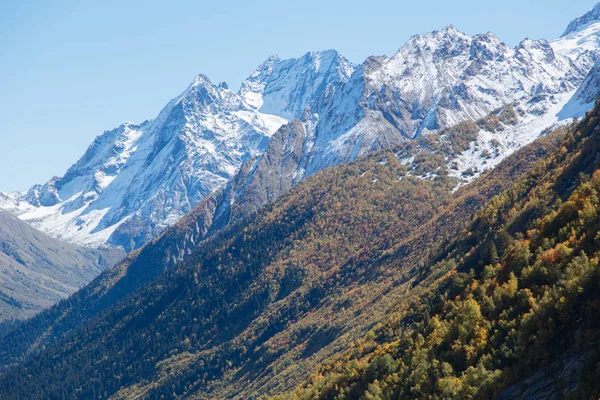 Dombay mountains, trekking in national park to the Alibek waterfall and glacier, autumn landscape