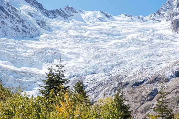 Dombay mountains, trekking in national park to the Alibek waterfall and glacier, autumn landscape