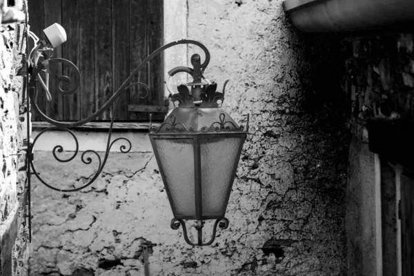 Old lantern in an rural alpine village — Stock Photo, Image