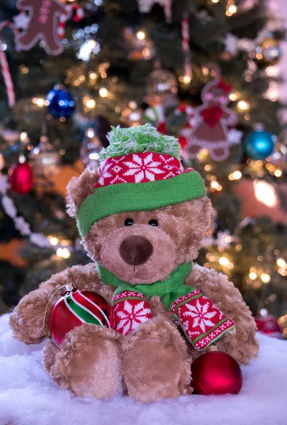 Brown stuffed Christmas bear in a hat an scarf — Stock Photo, Image